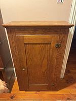Front view of pine cupboard closed