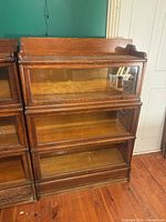 Full front view of three-section oak barrister bookcase