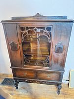 Full view of walnut china cabinet front