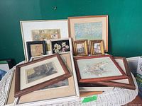 Group shot of all framed art prints on wicker surface