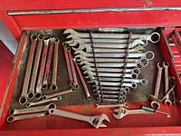 Drawer view showing full assortment including lined Craftsman set and additional wrenches