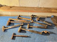 Overview of all hammers on blue surface