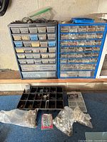 Overall view of two drawer cabinets, compartment tray, screw kit and bags