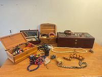 overall view of jewelry boxes and assorted jewelry spread out