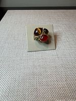 Front view of Lia Sophia multi-stone ring on display pad