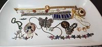 Overview of full jewellery lot displayed on white tray