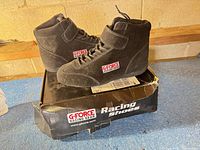 Shoes on original box showing side profile and branding