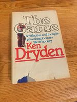 Front of book with dust jacket, showing title and tear at bottom edge