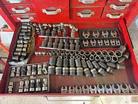 Drawer view showing entire assortment of sockets, crowfoot wrenches, and extensions