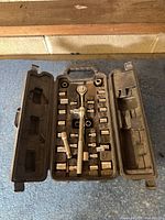 case open displaying ratchet, extensions, sockets in moulded tray