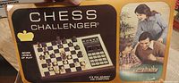 Front of Chess Challenger box showing image of electronic board and family photo