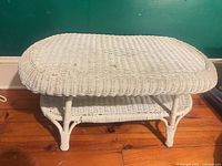 Overall view of white wicker coffee table