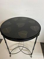 Full view of accent table showing top and legs