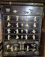 Front view showing full chest with drawers and cabinet doors