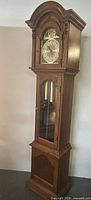 Full height view of grandfather clock showing entire case and proportions