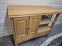 Front view showing doors, shelves, drawer