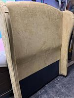 Front view of olive velvet wingback headboard