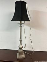 Full view of lamp showing base, column, shade and cord