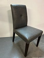 High-back dark gray leather chair front angle
