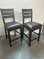 Full view of both chairs showing design and condition