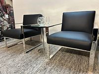 Front view of both chairs side by side on carpet