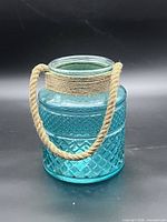 Front angled view showing diamond pattern, color, rope handle