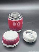 Food jar disassembled showing stainless interior and spoon in lid