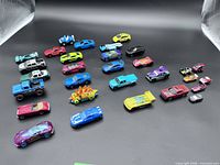 Full lot overview showing all 24 vehicles on black background