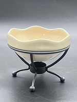 Overall view of fondue bowl in stand