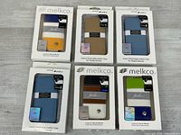 Six boxed Melkco Jacka Type leather cases assorted colors