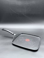 Overall view of square skillet showing interior and handle