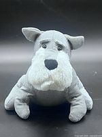 Front view of grey fabric dog door stopper