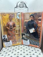 Both boxed dolls side by side