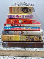 Entire stack of nine books showing titles and spines