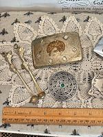 Overall lot showing buckles, concho, spoons