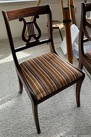 Side chair showing lyre back and striped seat