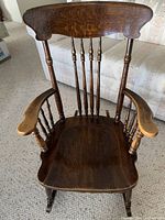 Front view showing seat, back spindles and arms