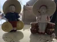 Front view of both figurines showing colours and forms