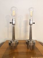 Full view of both chrome lamps with bulbs