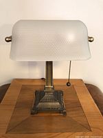 Front view showing frosted dimpled shade and metal base