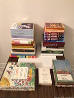 Overall view of all books, colouring books, notepad and blank books on table