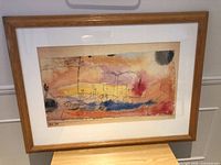 Framed Paul Klee print on tabletop, full view