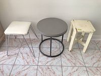 All three items: two stools, round side table