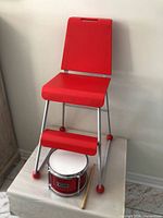 Chair and drum together for scale and completeness