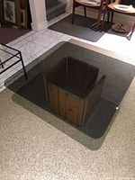 Overhead view showing smoked glass top and wood base