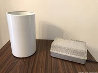 Cylinder and rectangular glass fixtures side by side