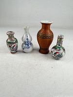 Group shot of all four vases standing upright