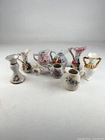 Entire lot of eight porcelain floral pieces