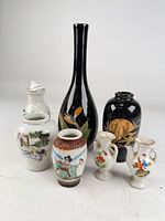 Front view of all seven porcelain pieces