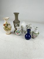 Group of six assorted vintage vases showing size and variety